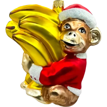 Małpka z bananami w świątecznym stroju